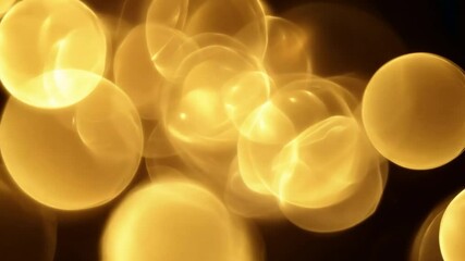 Poster - Abstract golden lights bokeh pattern with circular shapes creating a dreamy background effect for various design projects 4k video footage