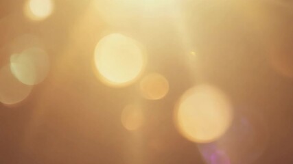 Poster - soft and dreamy background with glowing light bokeh effect in warm tones for artistic and creative p