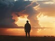 © Atcharasiri - Solitude Amidst Sunset: A silhouetted figure stands, framed by a breathtaking sunset, conveying introspection, peace, and a deep connection with the natural world.
