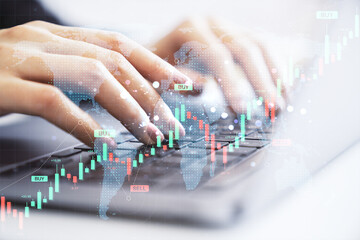Aufkleber - Female hands typing on laptop keyboard with forex candlestick chart, world map overlay, and buy-sell indicators on light background.