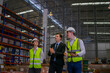 © Suney - Blue collar workers are working and meeting at warehouse.