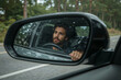 © Gustav - Introspective Journey, A Driver's Reflection in the Car Mirror Captures a Moment of Puzzled Contemplation on the Road