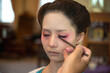 © Jack Tamrong - Unknown makeup artist doing traditional Geisha or Maiko make up to young Japanese woman