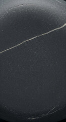 Poster - Close-up of dark gray stone texture, showing fine granular surface and a thin crack, suggesting natural ruggedness and strength, ideal for background or design element
