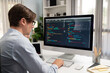 © InfiniteFlow - IT developer working online software development information on pc and laptop screen with typing to create new code program on updated version application project creating overall system. Pecuniary.