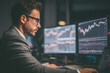 © Cevko - Man trading stock in front of computer. Generative AI.