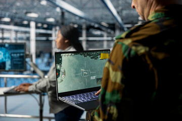 Poster - Team of military experts in data center doing mission coordination, operating satellite lock systems. Army units wearing uniform in server farm receiving real time battlefield intel from