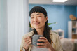 © Miljan Živković - positive japanese woman drink coffee and relaxing in the morning