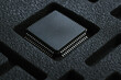 © newlifestock - Semiconductor chip in protective packaging highlights precision and care in industry production process for advanced technology components