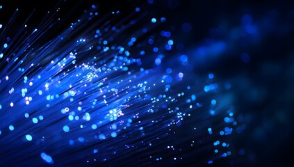 Poster - Close-up of illuminated blue fiber optic cables against a dark background