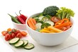 © ARTSPRIO - Bowl of vegetables including carrots, broccoli, and tomatoes