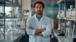 © Daiki - A young male scientist stands confidently in a modern laboratory, surrounded by various lab equipment and glassware, embodying professionalism and focus in his research environment.