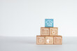 © Pakorn - A pyramid of wooden blocks with learning skill icons and education icon on white background with copyspace.,Concept for education,skill development, online learning,personal development.