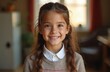 © Vadym - Smiling girl looks straight at camera. Ten year old happy student wearing white collar shirt and sweater. Elementary school, learning, education, joy, childhood, beautiful, cute child portrait.