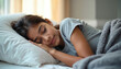© Vadym - Peaceful Indian teenage girl sleeping on soft pillow. Young woman resting in bed, calm serene sleep. Cozy home interior, comfort concept. Relaxation, dreaming, rest, night, tranquility.