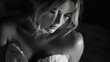 © Lumi_Studio - Black and white portrait of the bride, focusing on contrasts and shadows to highlight the gown's structure and the model's expression