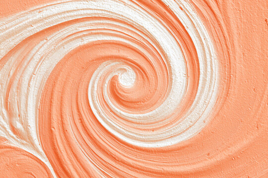 Swirled White Cream on Pastel Orange Background