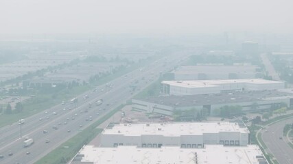Wall Mural - smoky, hazy atmosphere over highway in mississauga due to wildfire smoke