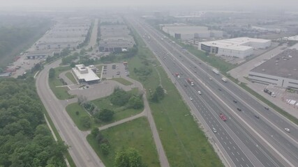 Wall Mural - highway and industrial area in mississauga, affected by wildfire smoke, aerial view