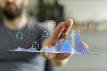 Poster - Stock photo of a person interacting with a holographic graph, showcasing business analytics and data visualization.