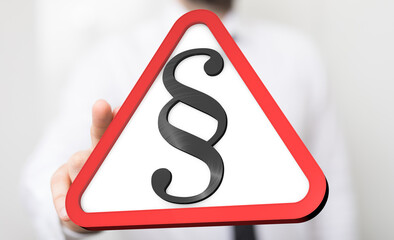 Poster - Hand holding a red triangle warning sign with a paragraph symbol.  Legal, law, caution concept.