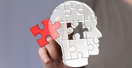 Poster - Conceptual image: hand placing puzzle piece into head.  Represents problem-solving, brainpower, and potential.