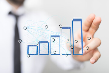 Poster - Stock photo of a hand interacting with a 3D bar chart, illustrating data analysis and business growth.