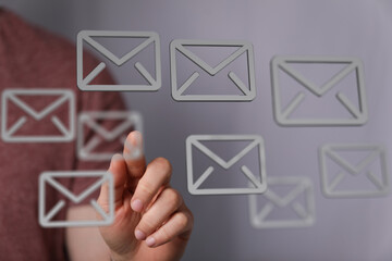 Poster - Hand interacting with digital email icons, representing communication and inbox management.