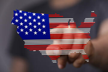 Poster - Digital image of a person touching a map of the USA designed with the American flag. Patriotism concept.