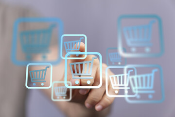 Aufkleber - E-commerce concept. Hand selecting a digital shopping cart icon on a touchscreen.