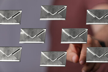 Poster - Abstract image of a man interacting with floating email icons.  Concept for communication, inbox, digital mail.