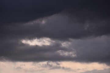 Wall Mural - dark rain cloud floating on sky at sunset in evening