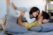 © we.bond.creations - Young couple cuddling in bed, sharing moments of affection and joy, enjoying a cozy morning together in their intimate space