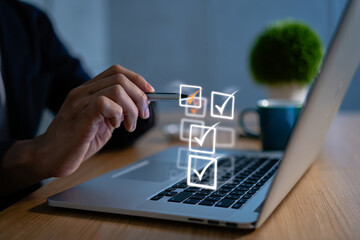 Poster - Person Checking Items Off a Checklist on Laptop