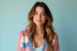 © Vii - A woman with long hair dressed in a pink and blue cardigan, simple and casual outfit
