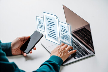 Poster - Person using laptop and smartphone to manage digital documents online