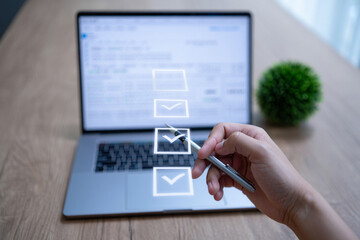 Poster - Person Checking Items on a Checklist on Laptop Screen
