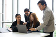 © NVB Stocker - business meetting : Professional business teamwork diverse company people in meeting. Group of Asian colleagues discussion on laptop computer during business meeting in conference room
