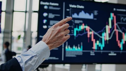 Poster - Business coach pointing at interactive screen showing candlestick chart, explaining company revenue and profit growth, financial analysis and investment strategy