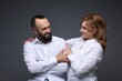© New Africa - Portrait of lovely couple on grey background