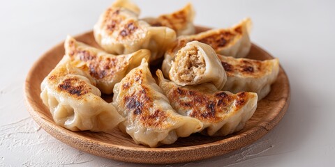 Aufkleber - Crispy Fried Dumplings on Wooden Plate, Representing Asian Cuisine and Culinary Delights