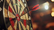 © widyastudio07 - Man with dart aiming at dartboard while working indoors, closeup
