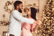 © Prostock-studio - Couple In Love. Smiling young african american man and woman dancing at home. Happy black family of two enjoying time together, celebrating event, holiday, anniversary or St Valentine's day