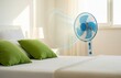 © Vadym - Interior Bedroom Scene With White Blue Fan Cooling Room During Hot Day Showing Minimal Design and Effective Heat Relief During Summer Climate