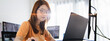 © Urbanscape - Asian female freelance programming developer work alone using desktop and laptop computer at home office. Information technology, smart woman, software engineer programmer coding job. Copy space