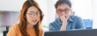 © Urbanscape - Asian male, female programming developer work together at home office, brainstorm discussion. Information technology, software engineer programmer coding job, man and woman coworker teamwork concept