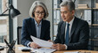 © SULTAN - Asian Executives Reviewing Documents Business Analysis Teamwork Financial Planning Professionalism