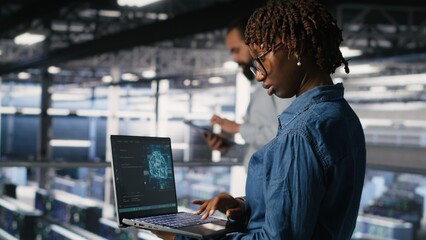 Poster - System administrators in data center monitoring AI LLM visualization. African american server farm coworkers overseeing rigs powering machine learning processes