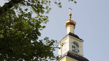 Poster - A historic clock tower with a functional weather vane on top, suitable for use in scenes depicting nostalgia, old town charm, or historical settings