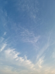 Wall Mural - it's a sunset sky with fluffy clouds.